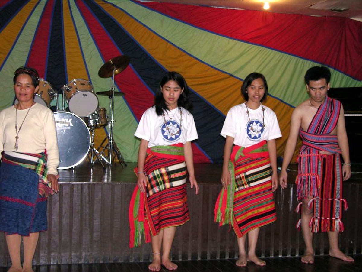 An Igorot dance being performed at the Baha'i National Arts Festival in the Philippines: (left to right) Sylvia Tamangen, Tahirih Tamangen, Christine Luis, Zorba Tamangen.
