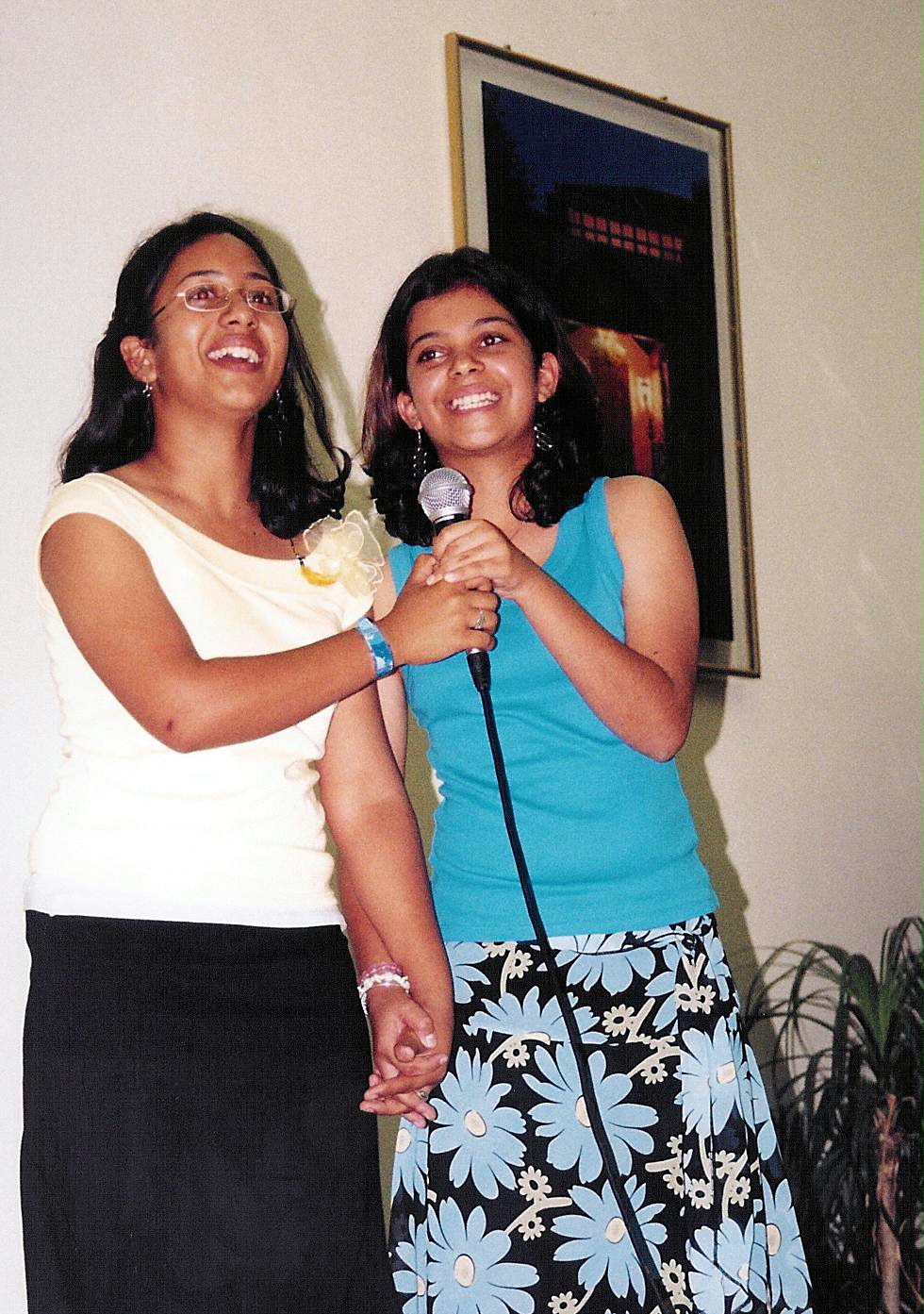 Friends in harmony...Botswana Baha'i youth Valentina Muraleedharan (left) and Nehal Rowhani presenting one of their songs at the jubilee celebrations.
