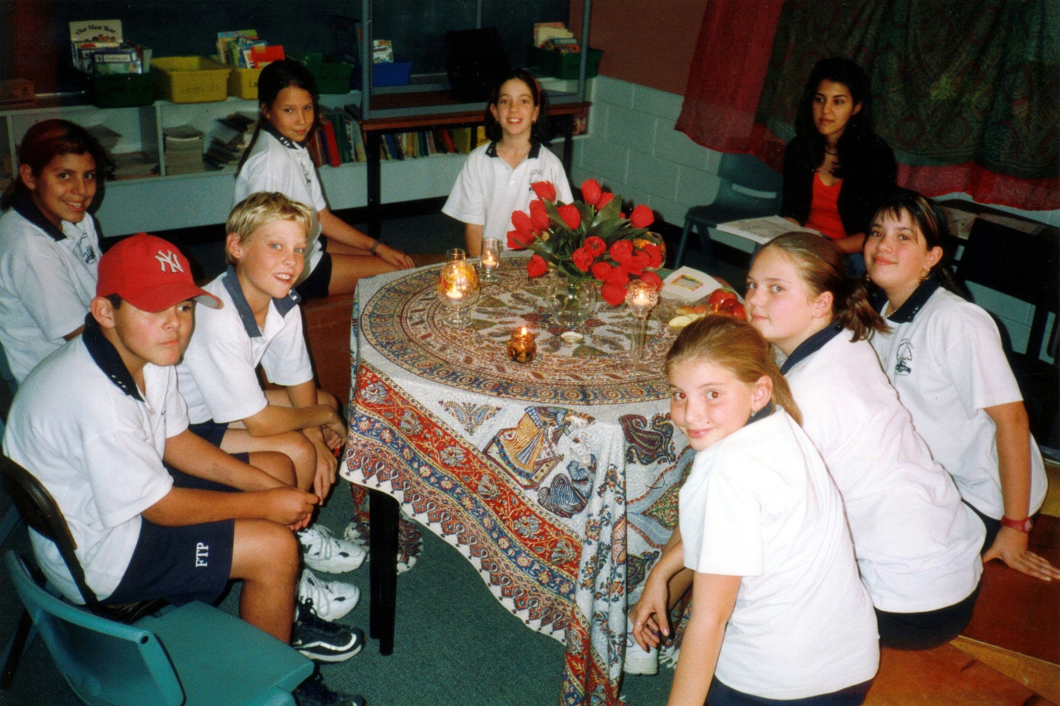 A Baha'i Education in State Schools (BESS) class on meditation at Fig Tree Pocket State School in Brisbane, Queensland, Australia. The teacher is Leva Azadi (background, right).