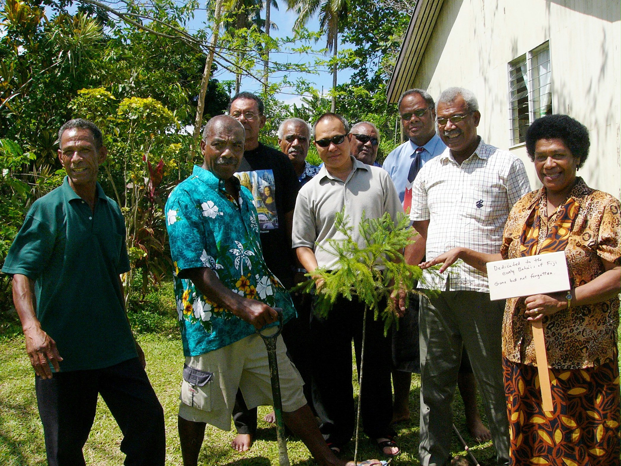 Members of the Fijian Baha'i community planting a Norfolk pine to commemorate the early Fijian Baha'is. Photo by Omid Saberi.