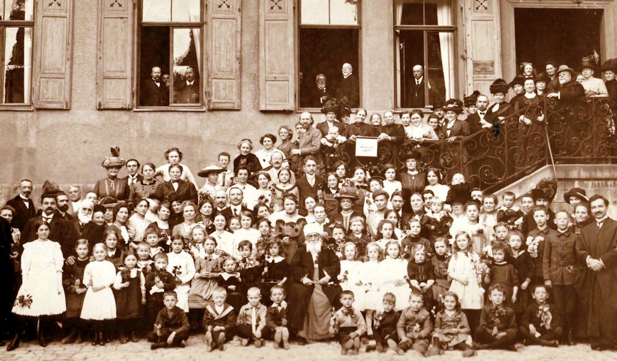 Abdu'l-Baha (front, center) on His visit to Germany in 1913, with Baha'is and guests.