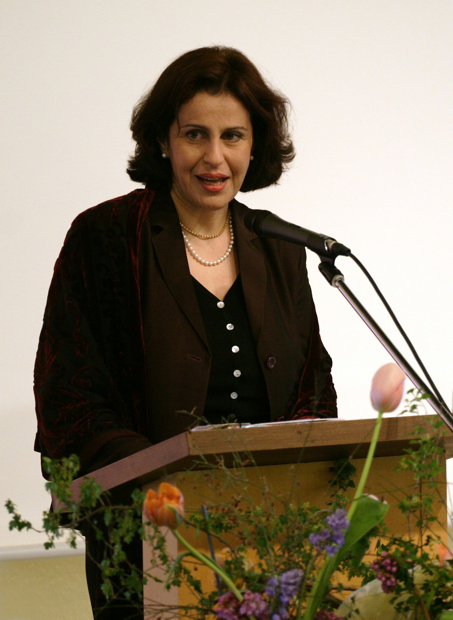 The chairperson of the National Spiritual Assembly of the Baha'is of Germany, Saba Khabirpour, addressing the centenary reception in Hofheim-Langenhain.