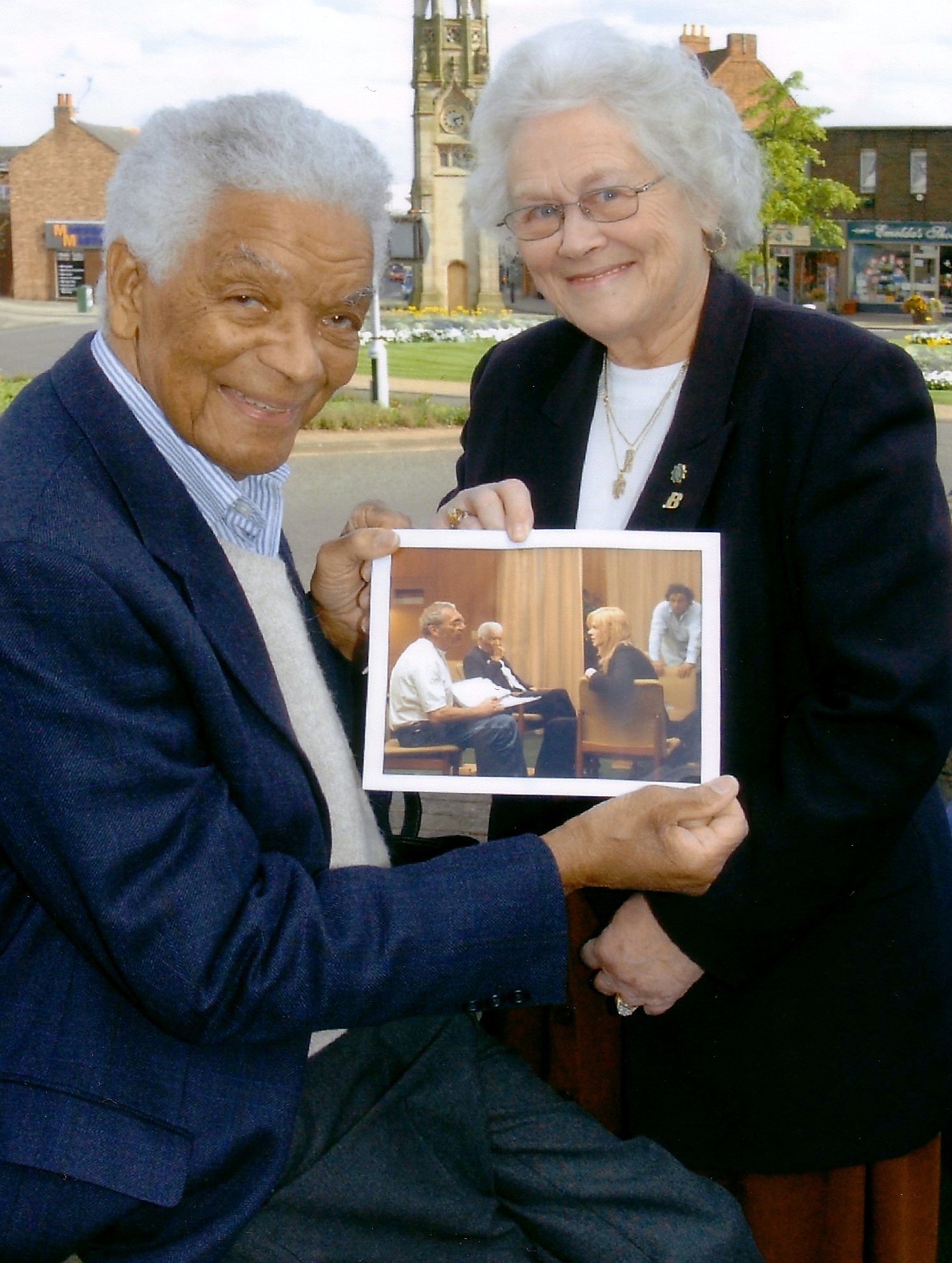 Actor Earl Cameron and his wife, Barbara, with a photograph taken on the set of "The Interpreter." Photo courtesy of Kenilworth Weekly News.