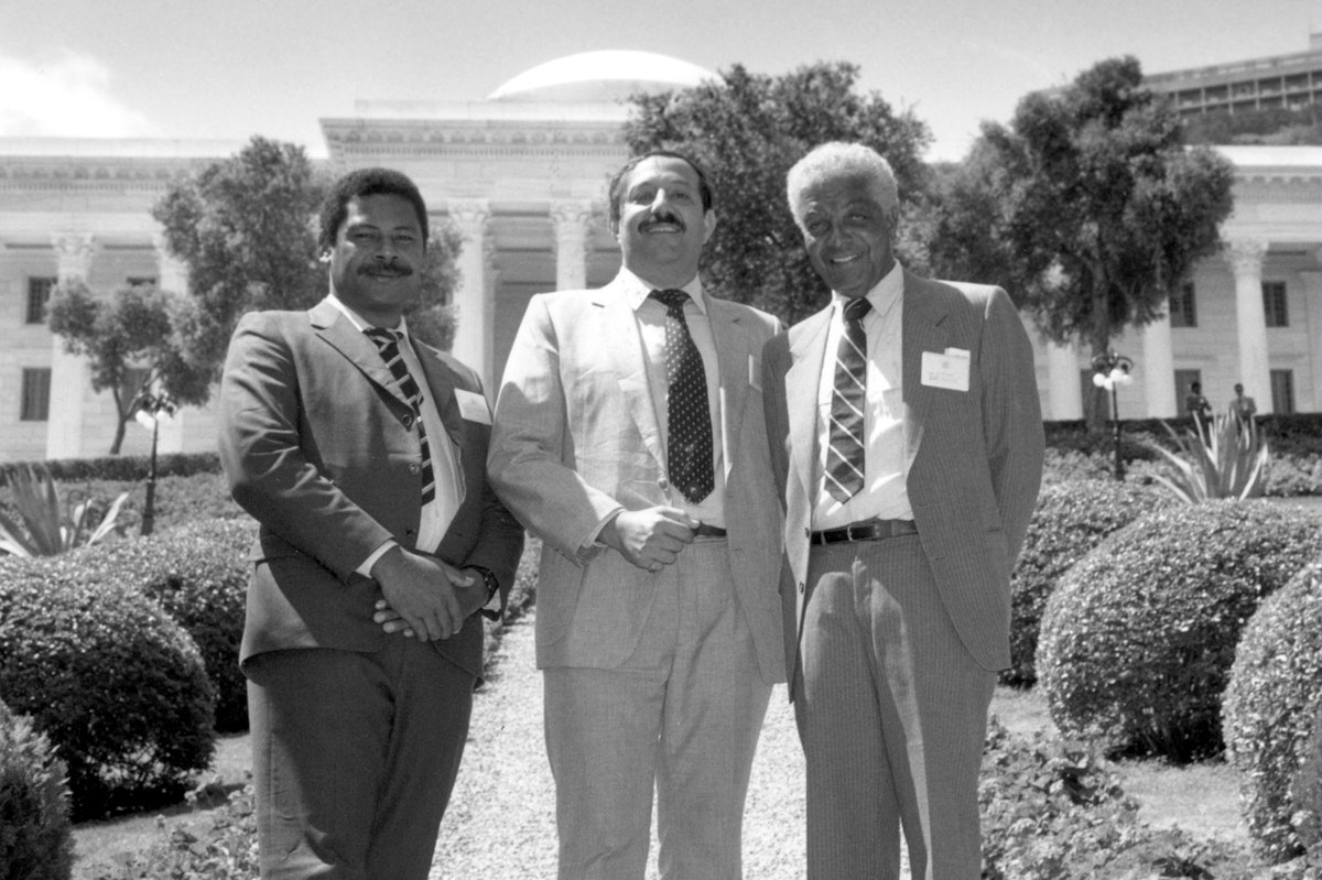 Earl Cameron (right) with two other members of the National Spiritual Assembly of the Baha'is of the Solomon Islands, Frank Haiku (left) and Kayhan Khadem, at the International Baha'i Convention at the Baha'i World Centre, Haifa, Israel, 1988.