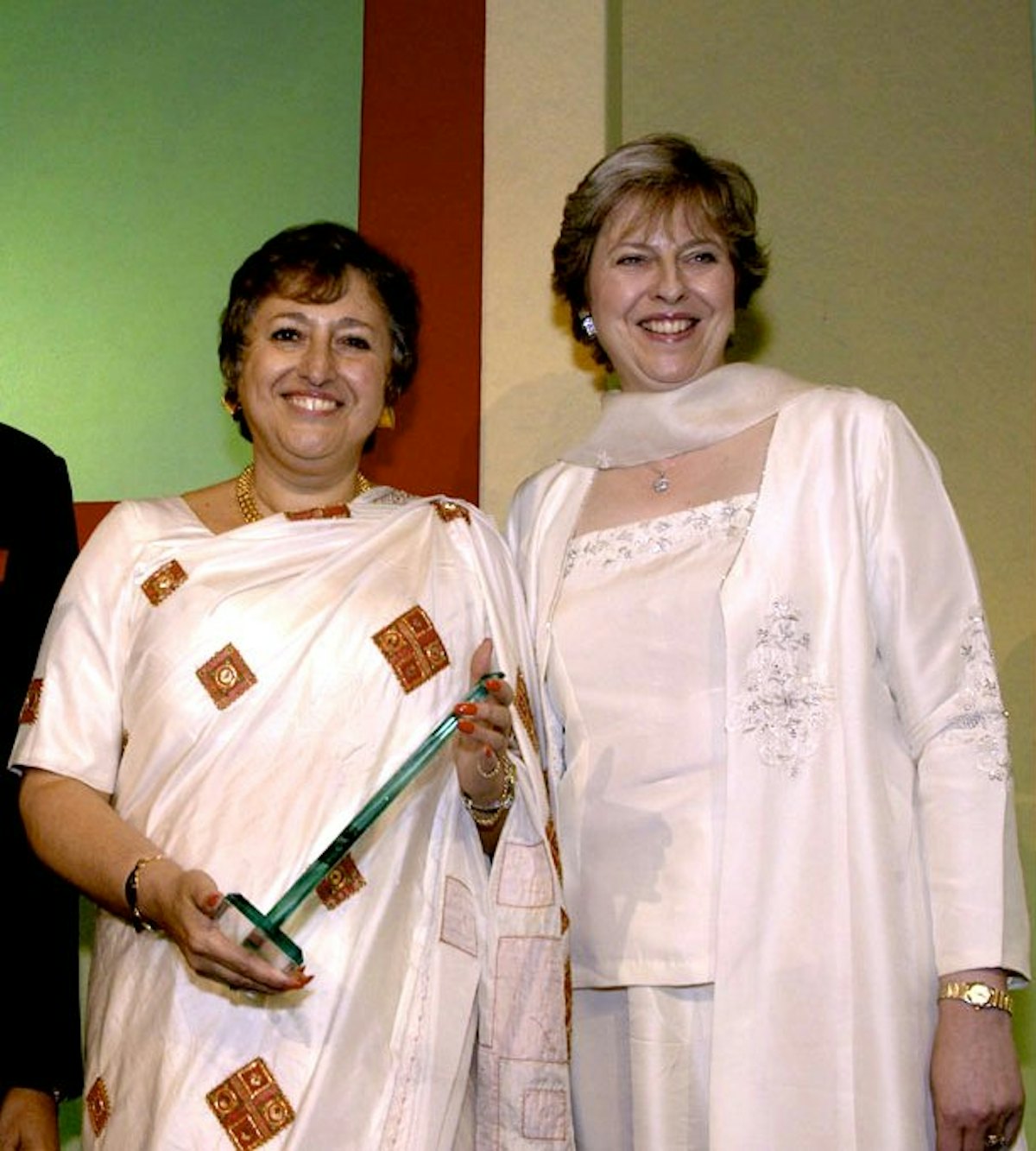 Member of the Parliament Theresa May (right), who presented the "Business Woman of the Year" award at the Asian Women of Achievement Awards ceremony, 2005, to Jyoti Munsiff. Photo courtesy of Asian Women of Achievement Awards.