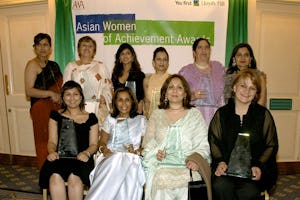 Jyoti Munsiff (standing, second left) with other award winners at the Asian Women Achievement Awards ceremony, 2005. Photo courtesy of Asian Women of Achievement Awards.