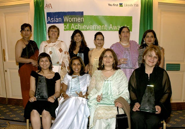 Jyoti Munsiff (standing, second left) with other award winners at the Asian Women Achievement Awards ceremony, 2005. Photo courtesy of Asian Women of Achievement Awards.