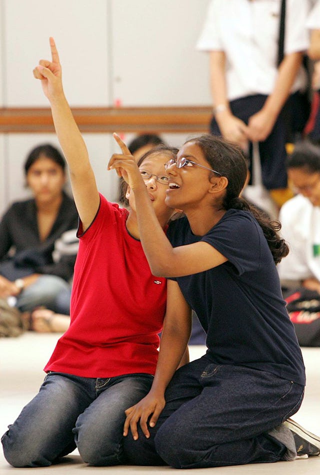 Pointing to a united future -- dancers in the Singaporean Baha'i junior youth dance troupe performing at an event for youth organised by the World Bank.