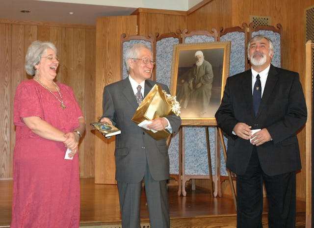 Erica Toussaint, Japanese Ambassador Ryozo Kato, and Foad Katirai, after Dr. Katirai gave Ambassador Kato a copy of his book, "Global Governance and the Lesser Peace," on 4 September 2005 at Green Acre Baha'i School.