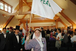 Anne Gordon Perry, portraying Green Acre Founder Sarah Farmer, holding a peace flag, during ceremonies on 4 September 2005 commemorating the 100th anniversary of the Portsmouth Peace Treaty.