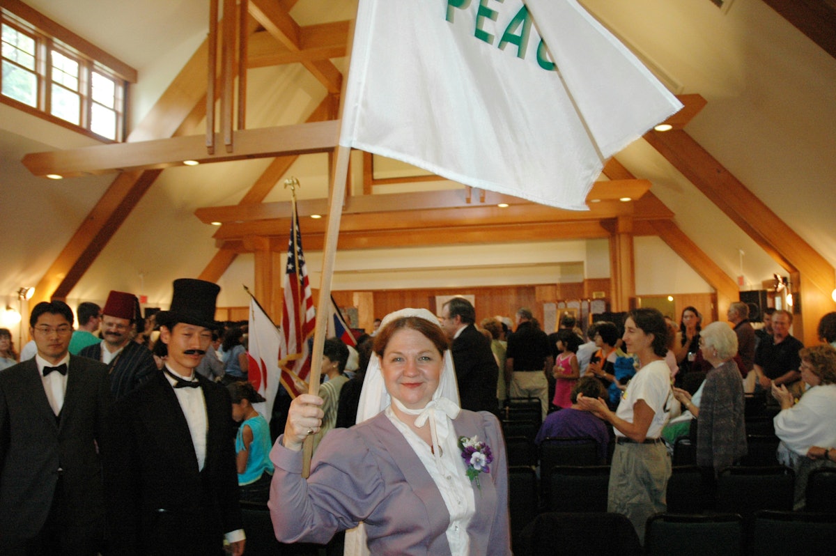 Anne Gordon Perry, portraying Green Acre Founder Sarah Farmer, holding a peace flag, during ceremonies on 4 September 2005 commemorating the 100th anniversary of the Portsmouth Peace Treaty.
