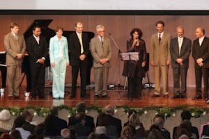 The nine members of the National Spiritual Assembly of the Baha'is of Germany, the community's elected national governing council, addressed the jubilee gathering as a corporate body.