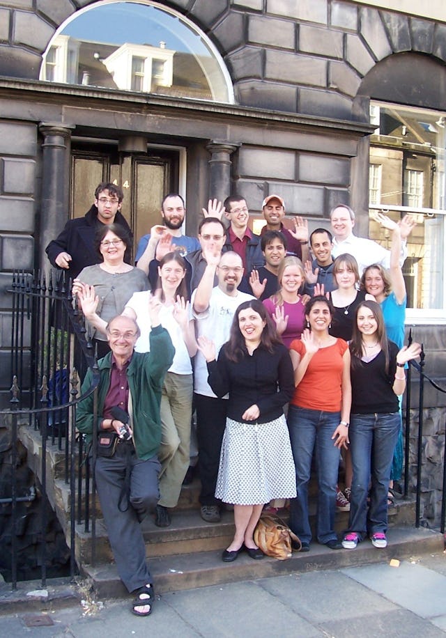Some local Baha'is at the entrance to the new Baha'i center in Edinburgh.