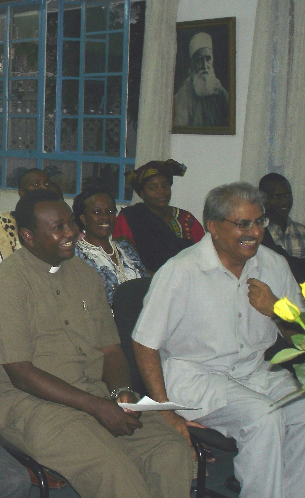 A lighthearted moment during discussions at the International Day of Peace gathering organised by the Baha'is of Tanzania.(Front row) Secretary of interrelations dialogue of the Catholic Church Rev. Father Gallus Marandu (left), Aga Khan Council representative Dr Navruz Lakhani.