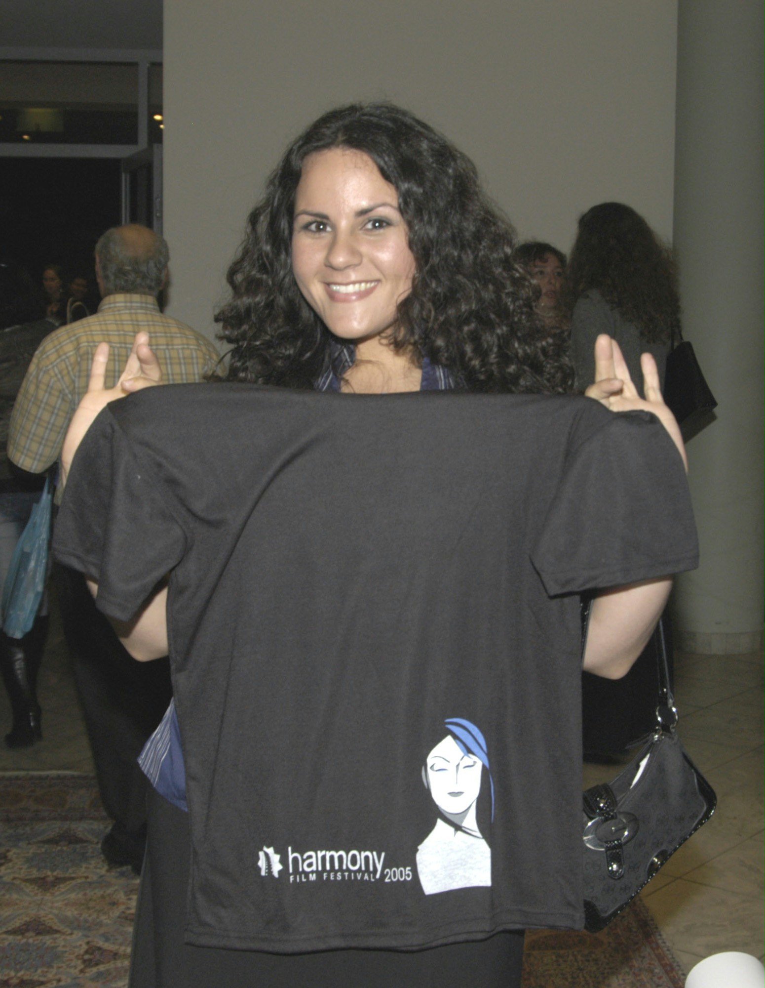 Shideh Faramand, winner of the "audience choice" and "achievement" awards" for her comedy "In Time," displays a Harmony Film Festival T-shirt.