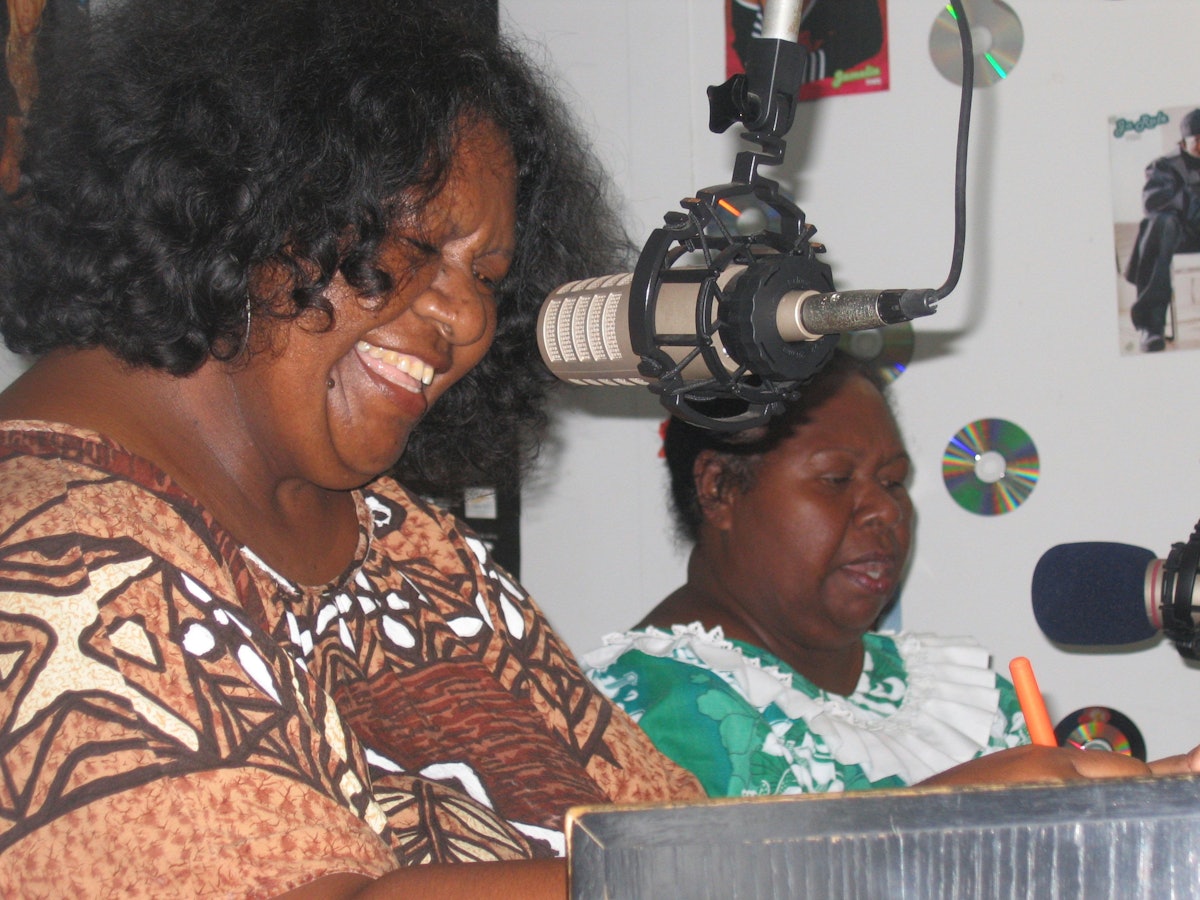 Janelle Gebadi (left) and Ina Aiputa presenting their weekly Baha'i-inspired radio program.