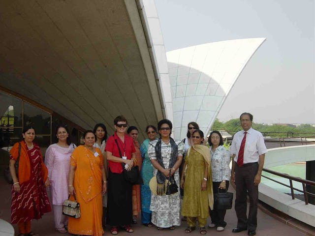 The First Lady of Fiji, Leba Qarase (fifth from right, with hat) and her entourage visiting the Baha'i House of Worship in New Delhi. Escorting the visitors was Shatrughun Jiwnani, the Temple's public relations general manager (right).