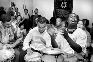 Drummers send out energy and inspiration during a Hush Harbor devotional meeting at the New York Baha'i Center. (Photograph by Mike Relph)