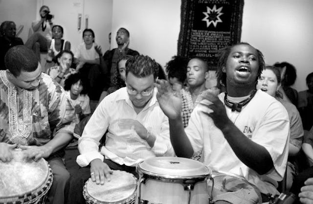 Drummers send out energy and inspiration during a Hush Harbor devotional meeting at the New York Baha'i Center. (Photograph by Mike Relph)