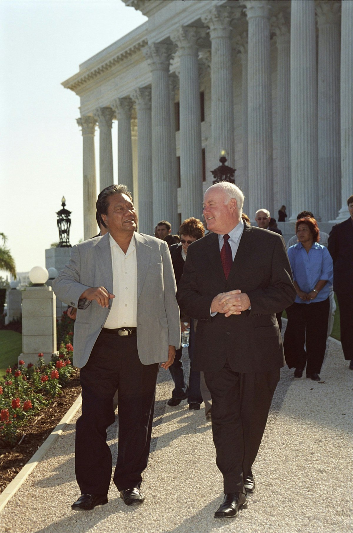 President Kessai Note of the Republic of the Marshall Islands, left, escorted by the deputy-secretary of the Baha'i International Community, Murray Smith, leaving the Seat of the Universal House of Justice for a visit to the Shrine of the Bab and its surrounding terraces.