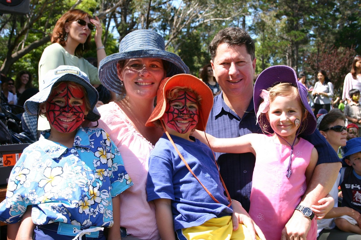 Angela and Gary Cowan of Gosford with their children during face-painting and other recreational activities held in the grounds of the National Baha'i Centre adjacent to the House of Worship after the children's service.