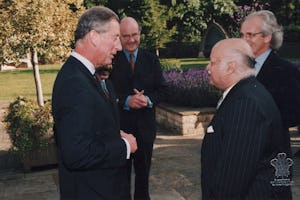 Another meeting of the Professor and the Prince. HRH The Prince of Wales, left, with Suheil Bushrui, foreground, right, at a special Temenos Academy function at Highgrove, the Prince's estate, in July 2002. In the background are Nicholas Parson, left, and David Cadman, right, both of the Temenos Academy. (Photo courtesy Suheil Bushrui.)