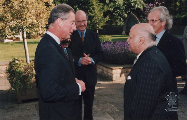 Another meeting of the Professor and the Prince. HRH The Prince of Wales, left, with Suheil Bushrui, foreground, right, at a special Temenos Academy function at Highgrove, the Prince's estate, in July 2002. In the background are Nicholas Parson, left, and David Cadman, right, both of the Temenos Academy. (Photo courtesy Suheil Bushrui.)