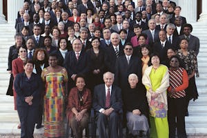 Gathered on the steps of the Seat of the Universal House of Justice on Mount Carmel, Haifa, Israel are members of the Continental Boards of Counsellors together with members of the Universal House of Justice, the International Teaching Centre, and, at front, centre, the Hand of the Cause of God Dr. Ali-Muhammad Varqa.