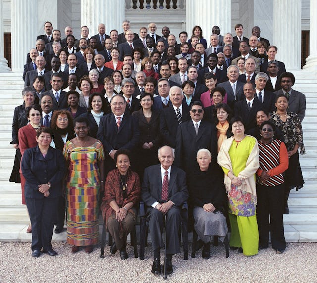 Gathered on the steps of the Seat of the Universal House of Justice on Mount Carmel, Haifa, Israel are members of the Continental Boards of Counsellors together with members of the Universal House of Justice, the International Teaching Centre, and, at front, centre, the Hand of the Cause of God Dr. Ali-Muhammad Varqa.