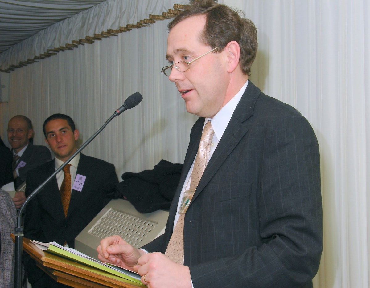 Peter Luff MP, Treasurer of the All Party Parliamentary Friends of the Baha'is, reads the Naw-Ruz greeting message from David Cameron MP, Leader of the Opposition at a 21 March 2006 Naw-Ruz celebration at the House of Commons.