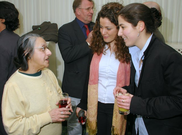 Phiroza Gan (left) of the Zoroastrian community in conversation with Noemi Robiati (right) and another Baha'i youth at a Naw-Ruz celebration in the House of Commons on 21 March 2006.