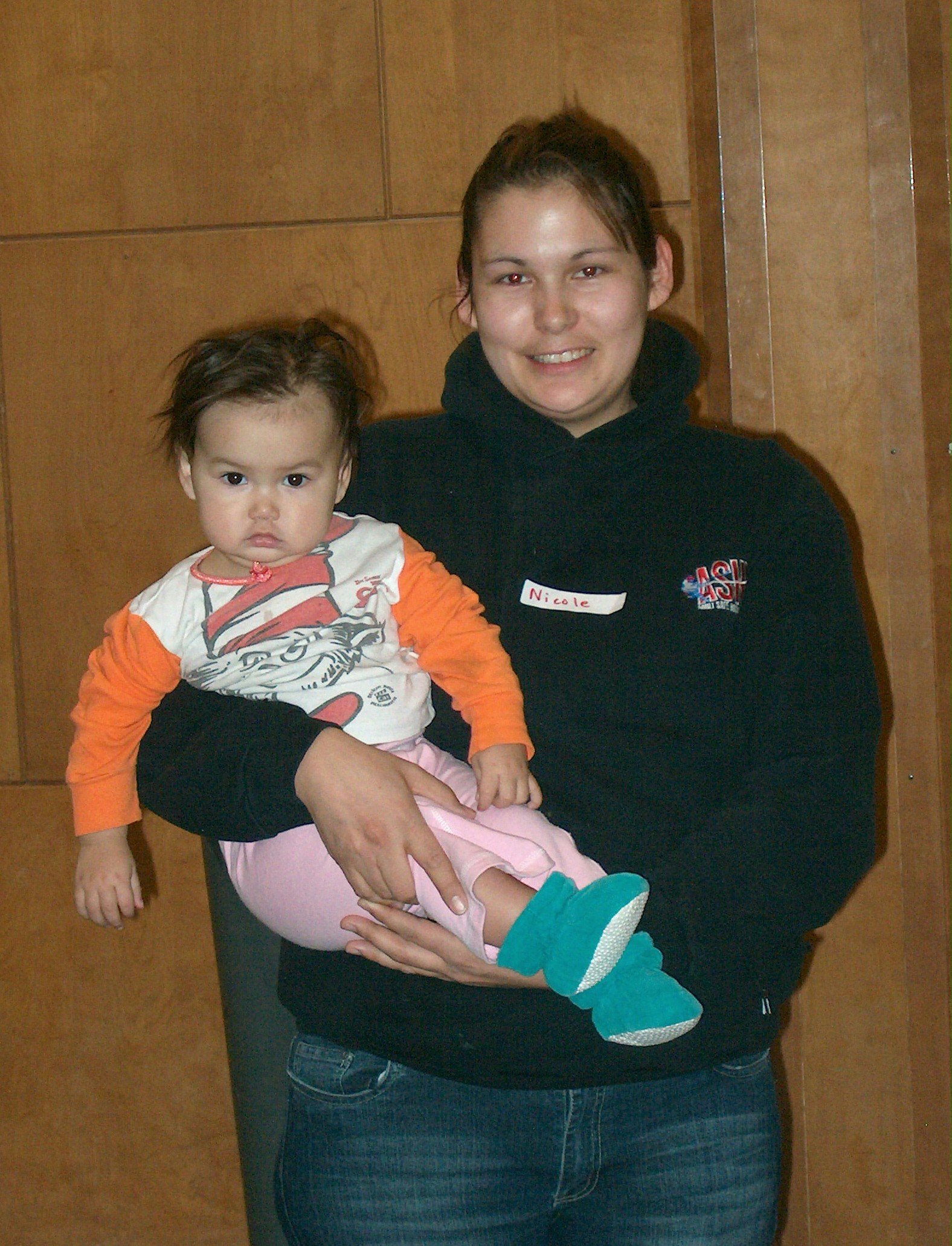 Nicole Richard, shown here with her youngest of four children, has been coming to the Baha'i-sponsored Family Virtues Breakfast for about two years. She said the regulars feel "like a huge extended family."