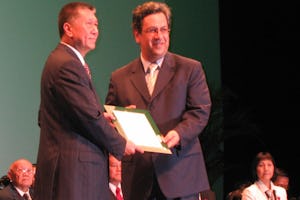 The Director receiving "The Honorific Title - Prestige" from the Chief Executive of Macau SAR, Mr. Edmund Ho Ha Wah.