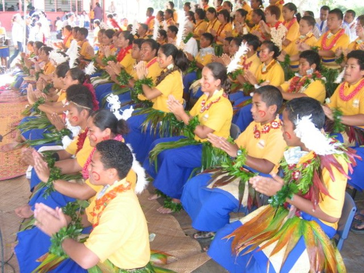 High school students performing the Ma'ulu'ulu traditional dance.