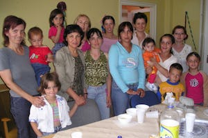 A group of mothers with their children in Jaszbereny, celebrating the completion of phase one of the project.