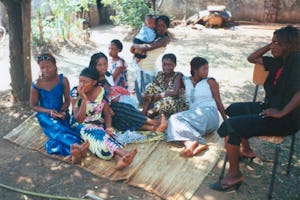 Youth from different countries enjoy each other's company during a lunch break.