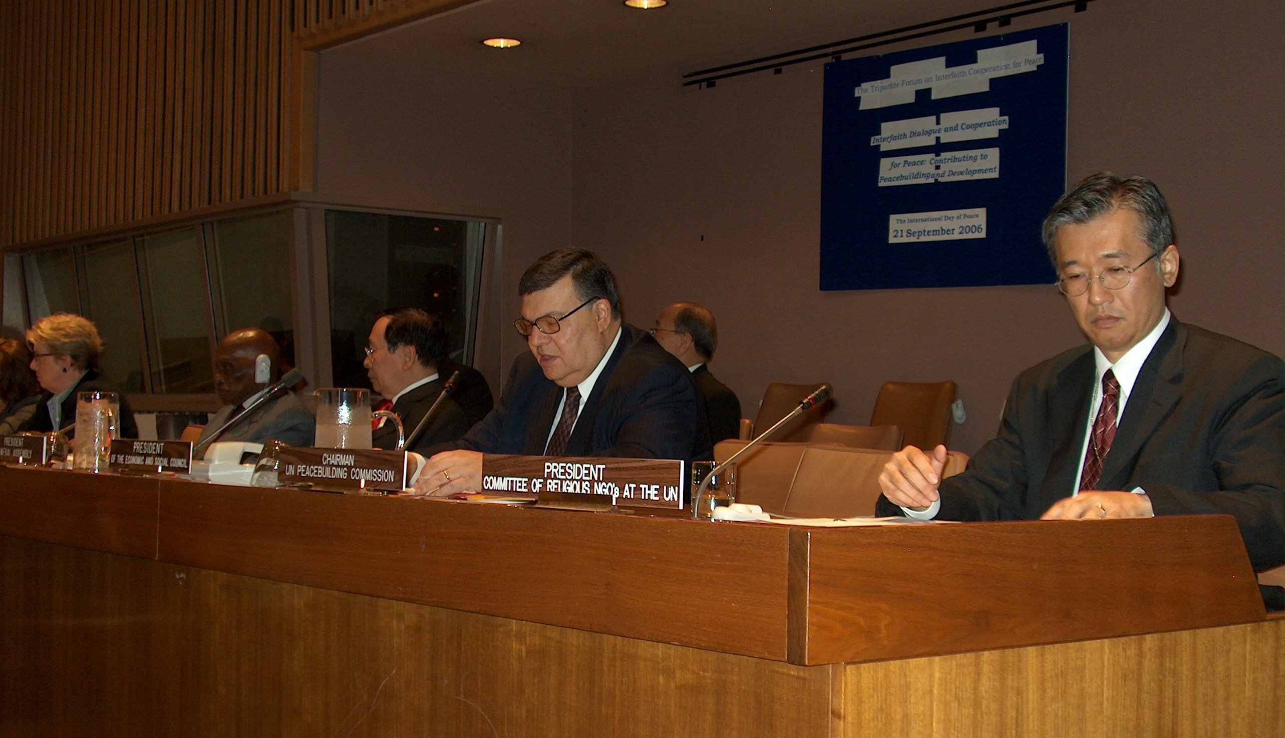 Members of the opening panel at the UN Conference on Interfaith Cooperation for Peace on 21 September 2006 include, from left, Hiro Sakurai of the Committee of Religious NGOs at the UN; Ali Hachani of the UN Economic and Social Council; Alberto G. Romulo, foreign affairs secretary of the Philippines; and Abdoulaye Wade, president of Senegal.