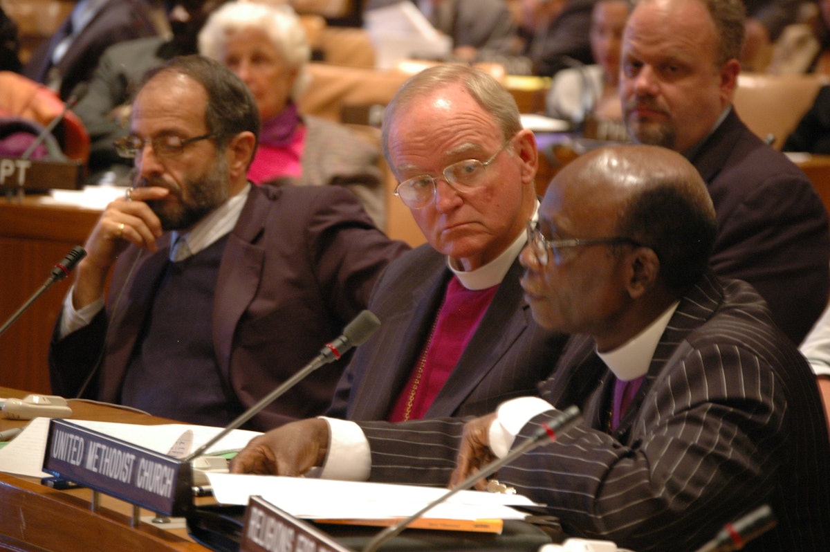 Among those participating in the UN Conference on Interfaith Cooperation for Peace on 21 September 2006 are, from left, John Grayzel, holder of the Baha'i Chair for World Peace at the University of Maryland; Bishop William Swing of the United Religions Initiative; and Bishop Joseph Humper of the United Methodist Church in Sierra Leone. (Photograph by Bud Heckman)