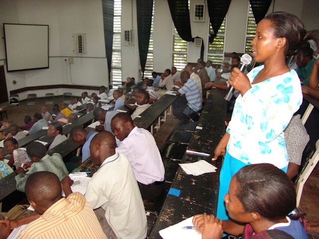One of the conference participants gives comments on the panelists' presentations.