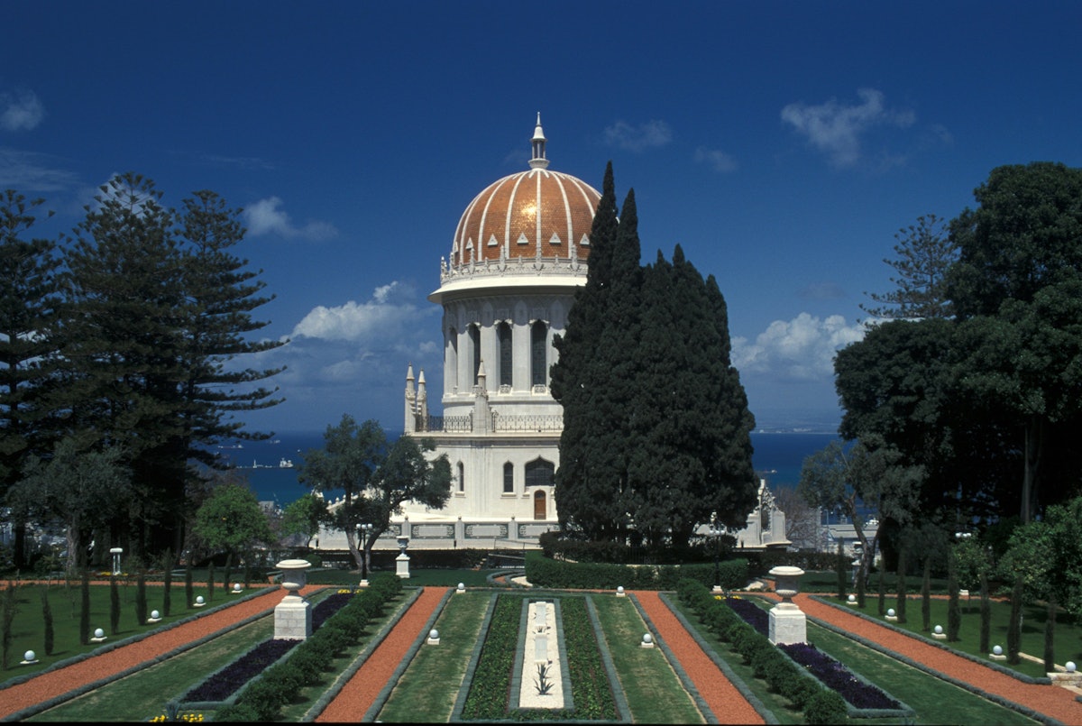 The Shrine of the Bab, with its golden dome, stands on the side of Mount Carmel in Haifa, Israel, overlooking the Mediterranean Sea.