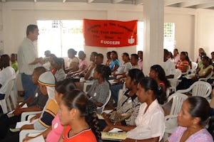 Brian O'Toole trains people to help collect data for a study about the spread of HIV/AIDS in Guyana. He credits the network of young helpers for a higher-than-usual rate of response to the questionnaire.