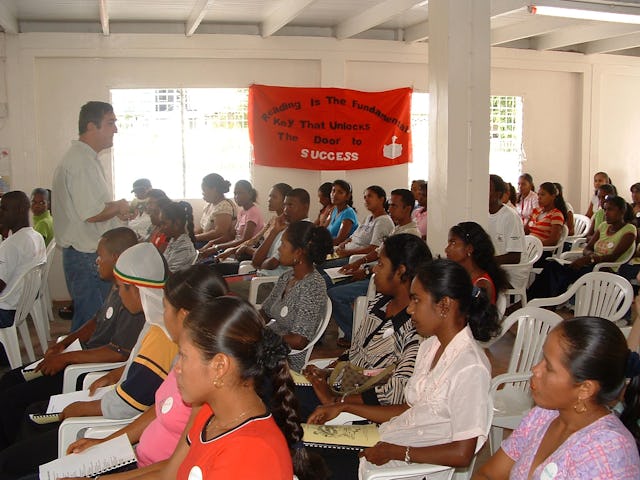 Brian O'Toole trains people to help collect data for a study about the spread of HIV/AIDS in Guyana. He credits the network of young helpers for a higher-than-usual rate of response to the questionnaire.