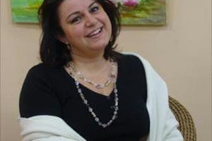 Video: Shideh Granfar interviews a guest on her weekly TV show in Blumenau, Brazil. On the air more than a decade, she believes her upbeat attitude - a reflection of her religious belief - is key to the show's success.