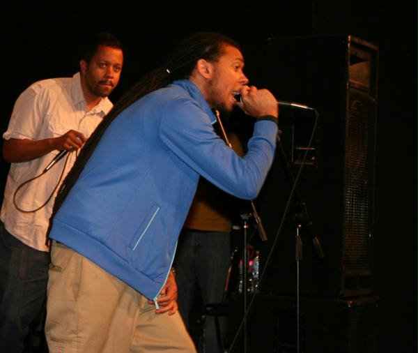 Vahid Brooks, with Mathai in the background, performs "Hush," a favorite piece from the album, according to an online survey.