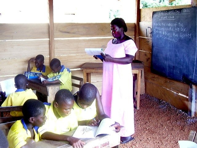 Teacher Victoria Kwofie leads students in their work at the Anyinabrim primary school.