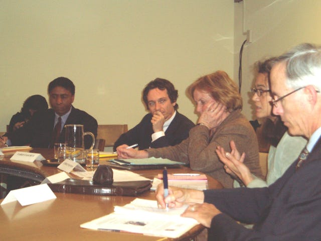 Panel members at a U.N. discussion about violence against women include, from left, Michael L. Penn, Fabien Fieschi, moderator Carolyn Hannan, Hedda Samson, and Mike Wessells.