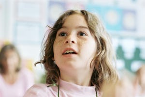 A member of the audience responds to a dilemma presented in a skit by People's Theater of Offenbach, Germany. The drama group, which performs in schools in several European countries, incorporates ideas from the children into its performance.