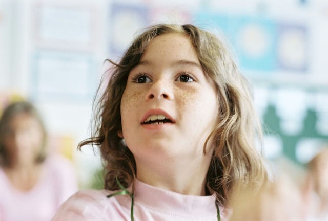 A member of the audience responds to a dilemma presented in a skit by People's Theater of Offenbach, Germany. The drama group, which performs in schools in several European countries, incorporates ideas from the children into its performance.