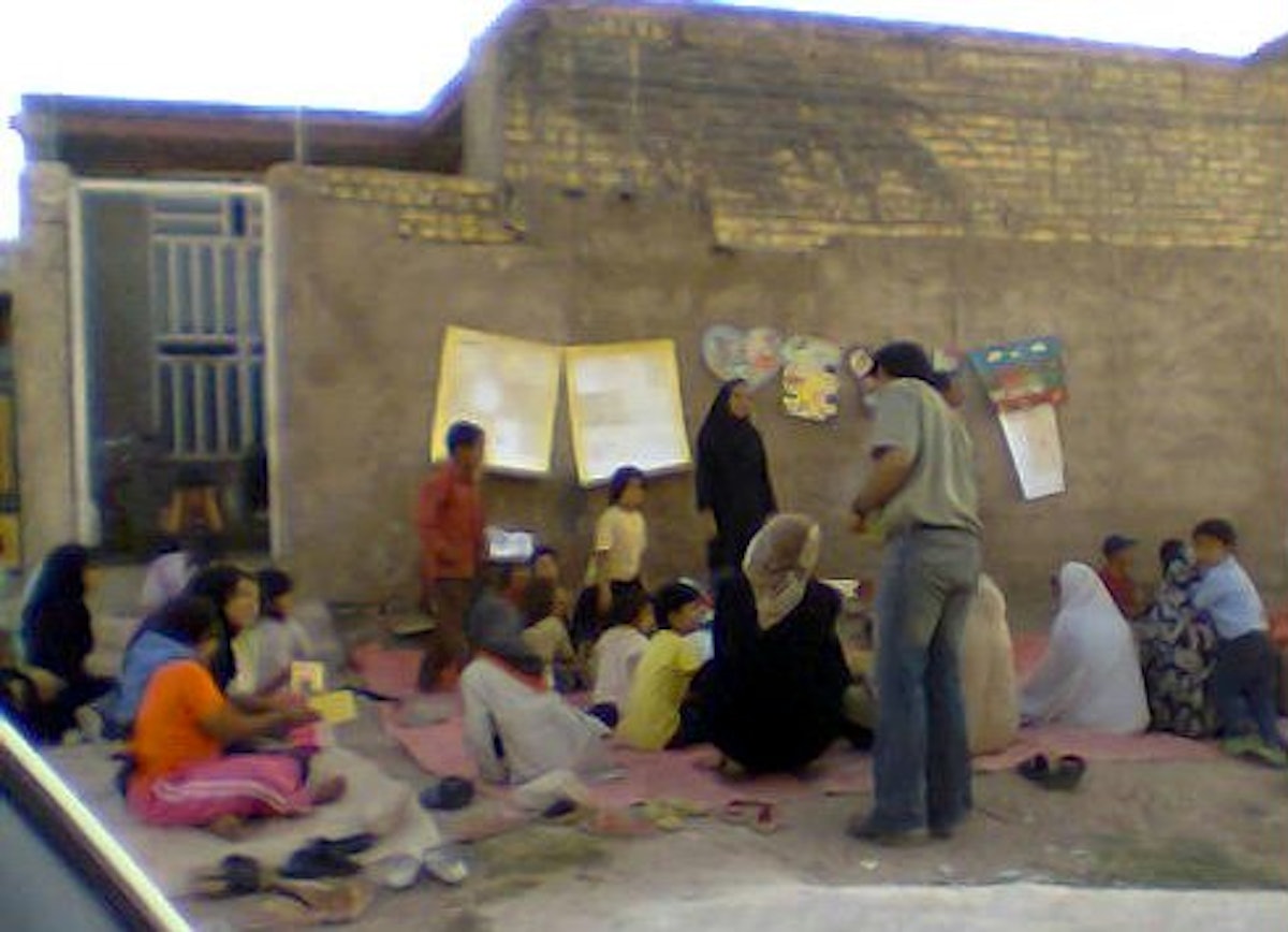Tutors and children gathered for class in Sahlabad, outside Shiraz, Iran. Such classes were shut down by the government in 2006.