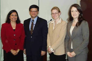 Among those present at the 14 February 2008 presentation of the statement "Eradicating Poverty: Moving Forward as One" were, from left, Bani Dugal, principal representative of the Baha'i International Community to the United Nations; Nikhil Seth, director of the Office for ECOSOC Support and Coordination and special assistant and chief of office to the undersecretary in the U.N. Department of Economic and Social Affairs; Julia Berger, senior researcher and writer at the BIC; and Tahirih Naylor, a BIC representative to the U.N.